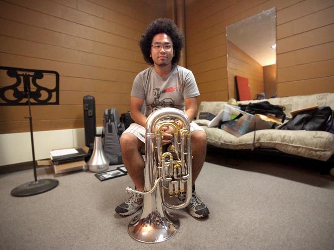 Kyohei Ando is photographed with his euphonium in Moody Music Building on the University of Alabama campus on Wednesday. Ando won first place in the Leonard Falcone International Artist Division Solo Competition held in White Hall, Mich. It is one of the most prestigious competitions in the world for euphonium players.