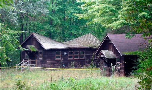 In an undated photo provided by the Michigan Department of Natural Resources, a cabin in need of a new roof is shown in the Waterloo Recreation Area in Waterloo. Starting Friday, motorists can pay $10 for a “recreation passport” to fund state parks when registering their vehicles.