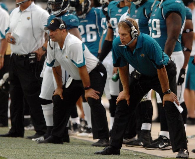 Jaguars head coach Jack Del Rio and defensive line coach Joe Cullen take a similar stance in the fourth quarter of the Jaguars' 28-3 loss to the Eagles on Sunday.