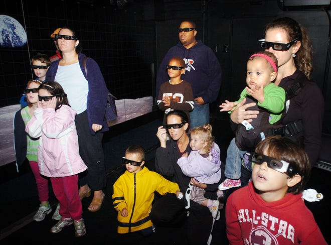 Children and adults Monday take in a 3D experience inside a NASA traveling Exploration Experience exhibit that is currently at the Chapman Middle School in Weymouth. Housed in a 60-foot trailer, the NASA exhibit features a 3D display and various presentations about NASA contributions. It will be there and open to the public both this afternoon and tomorrow afternoon.