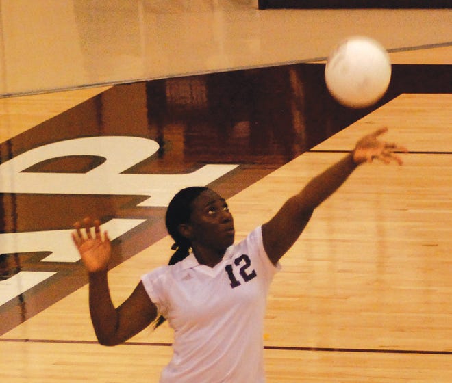 Sophomore Jaeden Barlow serves the ball during the two set game against East Peoria Sept. 21.
