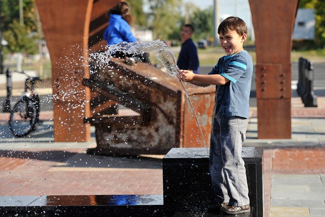 An unsuspecting James Jarrell, 5, plays in a fountain in Hilliard's new First Responders Park. The city plans to post rules banning activities such as playing in the fountain, hoping to maintain the mood of a 9/11 memorial.