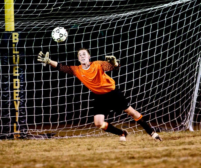 G-A goalie Seth Sprague makes a dive for a shot on goal. (Bob Stoler Photos)