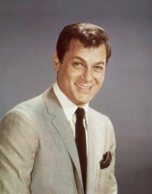 Actor Tony Curtis is shown in this 1965 file photo. Curtis, whose real name was Bernard Schwartz, was perhaps most known for his comedic turn in Billy Wilder's 'Some Like It Hot' with co-stars Marilyn Monroe and Jack Lemmon, has died at 85 according to the Clark County, Nev. coroner.