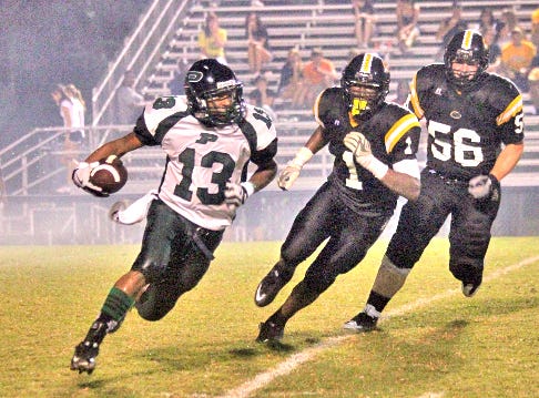PHS back Nick Thomas (13) gets around end for a gainer in recent action against St. Amant.