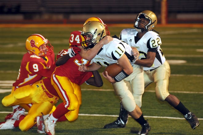 Galesburg quarterback Andrew Steck fight for yards in the Streaks 24-22 loss to Rock Island Friday night.