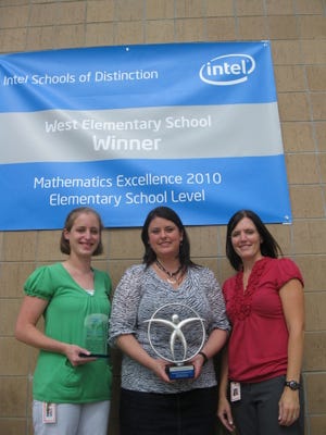 From left, teacher Angie McCune, principal Amy Flinn and teacher Teri Dow display the 2010 Intel Schools of Distinction Award Wamego West Elementary School won in mid-September for excellence in math instruction and programs. The school received top honors in the elementary school category, which had about 600 applicants.