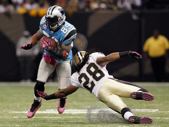 Carolina Panthers wide receiver Steve Smith, left, makes a move against New Orleans Saints safety Usama Young on Sunday in New Orleans. Smith was injured on the play.