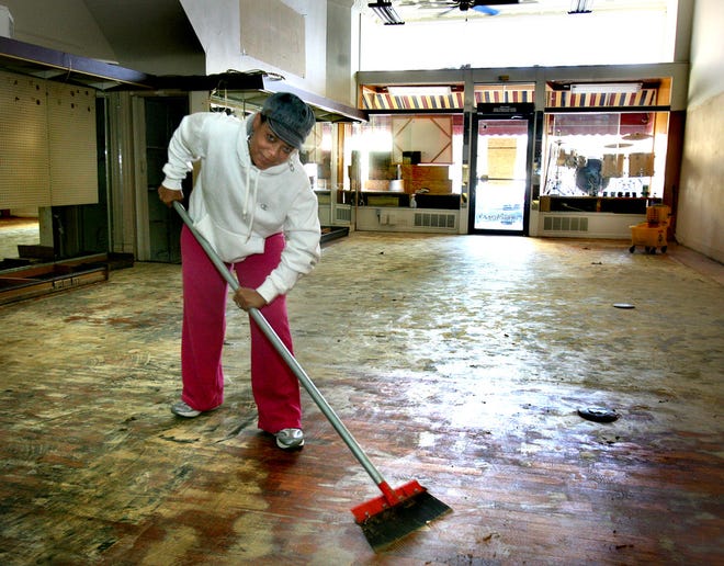 Lisa Kirk, co-owner of London’s, a live jazz cafe slated to open in November, was busy Monday scraping adhesive off the wood floor of the new business’s venue, the downtown Topeka building at 115 S.E. 6th that for decades housed Hillmer’s Luggage, Leather & Gifts.