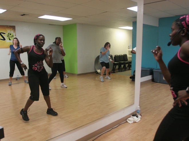 Gainesville Police Officer Farrah Lormil teaches a Zumba class at a studio on Northwest 23rd Avenue on Wednesday night in Gainesville.