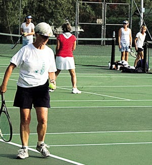 The city park courts were loaded with tennis tandems on Saturday.