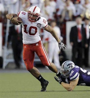 Roy Helu, in breaking this tackle by Kansas State linebacker Alex Hrebec, gave Nebraska two 100-yard rushers with his eight-carry, 110-yard performance in Thursday's 48-13 rout of the Wildcats.