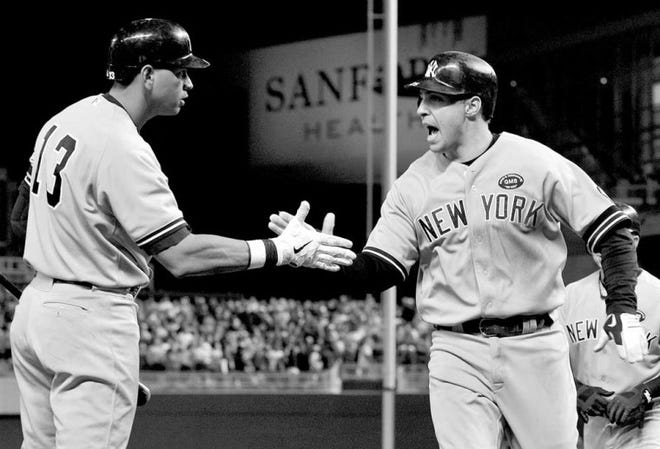 The Yankees' Alex Rodriguez (left) congratulates Mark Teixeira, who hit a two-run home run during the seventh inning Wednesday against the Twins in Minneapolis.
