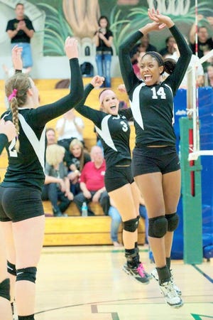 Nease volleyball players Kamryn Sherman (2), Ashley Weinzimmer (3) and Kabrione Coleman (14) celebrate during Thursday night's match against Ponte Vedra. The Panthers won 3-0. By LINDSAY WILES GRAMANA, Special to The Record