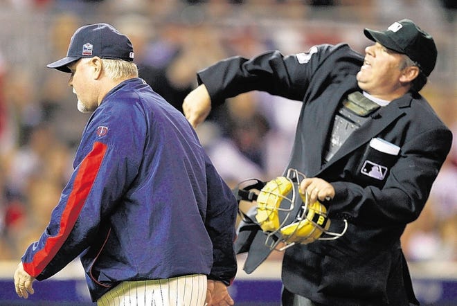 Home plate umpire Hunter Wendelstedt, right, throws out Twins manager Ron Gardenhire for arguing balls and strikes against the Yankees on Thursday in Minneapolis.