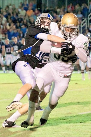 Bartram Trail player Dillon Varnadore (10) tackles Nease runner Kain Daub during Friday night's game at Bartram Trail. The Bears picked up a 16-8 victory. By LINDSAY WILES GRAMANA, Special to The Record