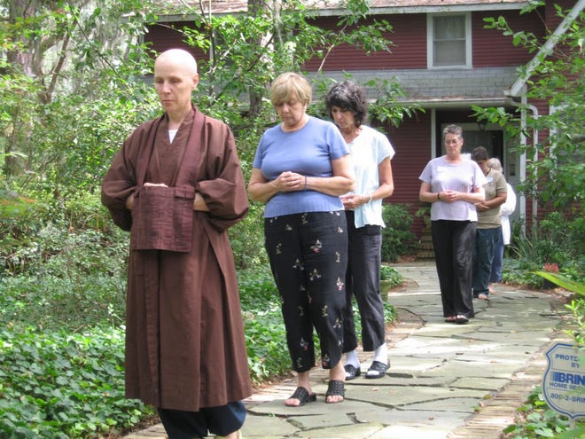 The Rev. Teijo Munnich leads a walking meditation at a 2008 workshop. Behind her are Lynn Platt, Marcia Berens, Jan Howard, Deborah Robinson and Susan Lamb.