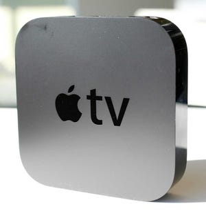 The new Apple TV converter is shown Wednesday in New York. The device grabs movies and TV show rentals from the Internet and displays them on a TV.