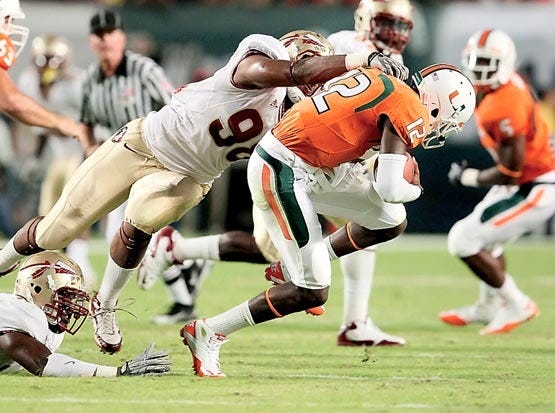Florida State defensive end Markus White sacks Miami quarterback Jacory Harris in the first quarter of Saturday's game in Miami. By WILFREDO LEE, The Associated Press