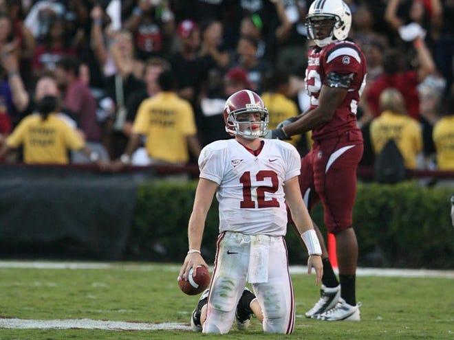 Alabama quarterback Greg McElroy (12) kneels on the field following a fourth quarter sack by the Gamecocks on Saturday