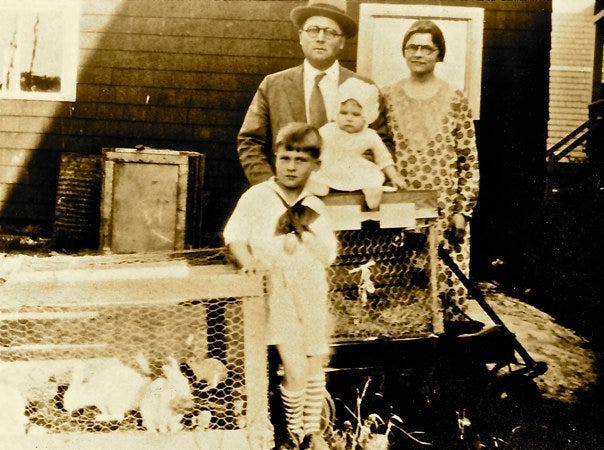 The Nease family getting their rabbits ready for the 1929 Pet Stock Showin Wollaston. Floyd Nease, president of Eastern Nazarene College, his wife Madeline, his son Stephen, who went on to serve as president of Eastern Nazarene College during the 1980s, and daughter Helen, who now lives in Oklahoma.