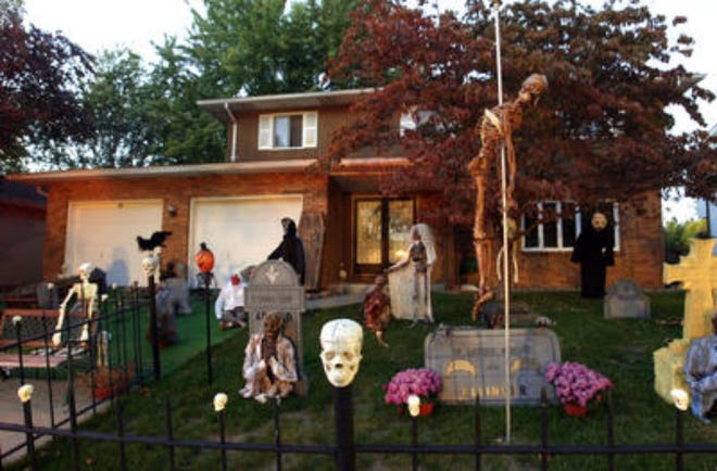 Halloween buff Allan Barnhart decks out his Springfield home on Hyde Park Place every Halloween with a yard full of decorations featuring gravestones bearing the names of residents in his neighborhood.