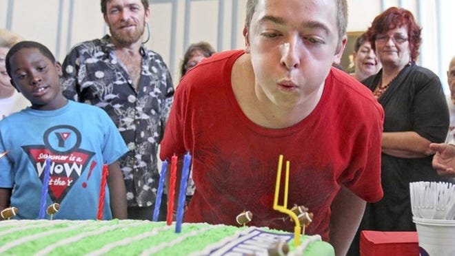 Michael Brewer celebrates his 16th birthday at Independence Hall Senior Living Community Center in Wilton Manors.