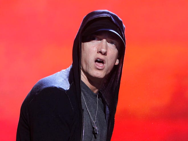In this Sept. 13, 2010 file photo, rapper Eminem performs at Yankee Stadium in New York. (AP Photo/Jason DeCrow, File)