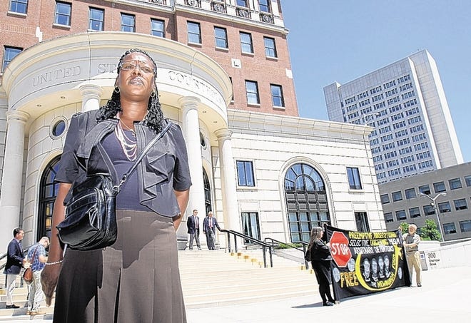 Alicia McWilliams-McCollum, aunt of David Williams of the so-called Newburgh 4, stands with protesters outside the federal court building in White Plains on June 21. She has criticized the FBI's role in the case.