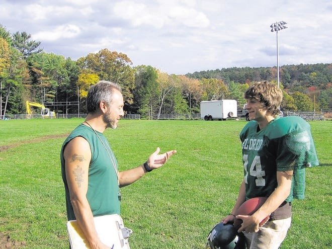 Eldred coach MIke Paradisis talks with Connor Walton during practice on Tuesday. Walton, a former soccer player, came out for the football team this fall and has earned a spot as a starting safety.