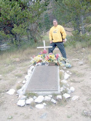 Flowers, wreaths and WSU memorabilia have been left at the bronze memorial plaque located at mile marker 217 of westbound I-70, one mile east of the Eisenhower Tunnel.
