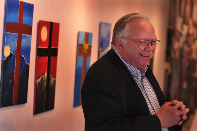 The Rev. Kirk Neely, senior pastor of Morningside Baptist Church, began painting last summer. Despite being colorblind, Neely has painted 
dozens of works, some of which will be featured at a reception Thursday at Wet Paint Syndrome in Spartanburg.