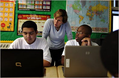 Randi Weingarten, president of the American Federation of Teachers, speaking with Bryan Reyes, left, and Joshua Dickey at the Green Dot New York Charter School in the Bronx.