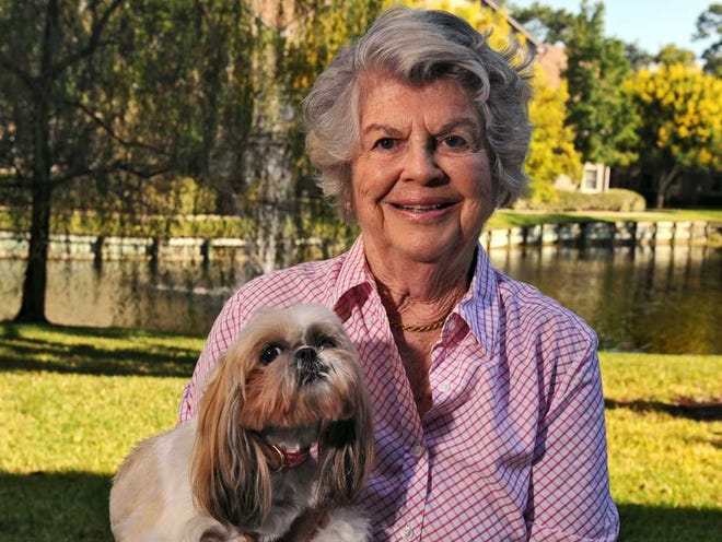 Former Times-Union writer Wini Rider Young of Ponte Vedra Beach had a mastectomy and has been cancer-free for 21 years. She writes that many women let their vanity and feminine psyche stand in the way of this life-saving procedure. She poses for a photo with her shih tzu, Suki outside her home.