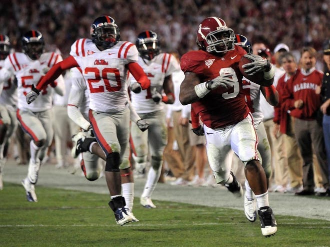 Alabama running back Trent Richardson (3) outruns Ole Miss defenders down the sideline for an 85-yard touchdown reception during the third quarter Saturday.