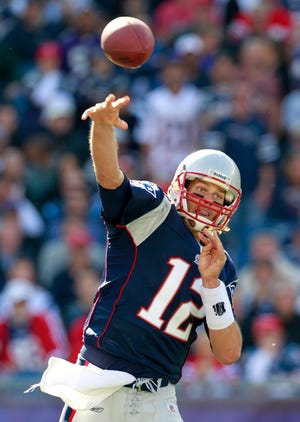New England Patriots quarterback Tom Brady passes in the second quarter of an NFL football game against the Baltimore Ravens, Sunday, Oct. 17, 2010, in Foxborough, Mass. (AP Photo/Michael Dwyer)