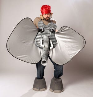 Matthew Lindsay, company member and teacher at the Hippodrome State Theatre, wears an en elephant costume created with a catcher's vest, dryer hose, bathroom pipes, car sunshades and lamp shades. Designed by Marilyn Wall, Hippodrome State Theater's costume designer Wednesday, October 20, 2010.