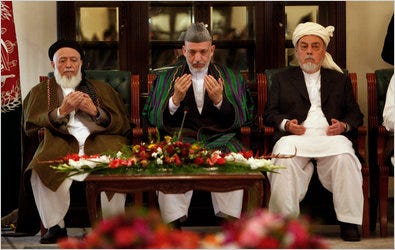 President Hamid Karzai of Afghanistan, center, prayed recently with members of a peace council looking for an end to the war.