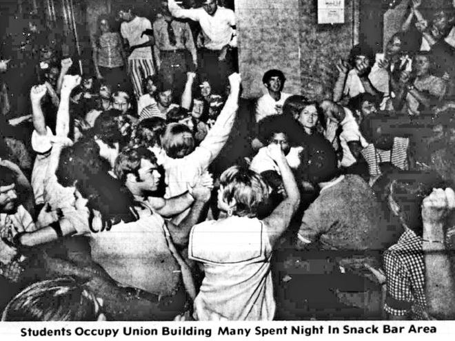 This newspaper clipping from the May 7, 1970, edition of The Tuscaloosa News shows University of Alabama students protesting in the Union Building, which was one of two buildings students occupied during about two weeks of unrest at the Capstone. The events of those days began as a protest against the deaths of four students killed in an anti-war rally at Kent State University.