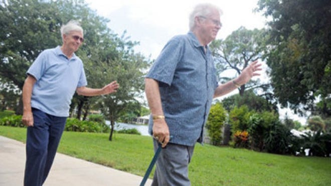 Robert Pingpank, left, and Richard Nolan, both 73, were the first couple to sign up for Palm Beach County's domestic partnership registry when it was launched in 2006. Here, they walk together to lunch, waving at a passerby.