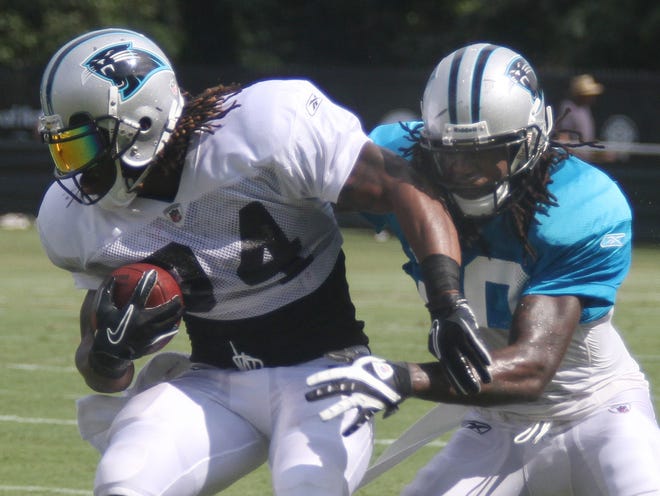 Charles Godfrey, right, defends against DeAngelo Williams during Panthers training camp in August at Wofford College.