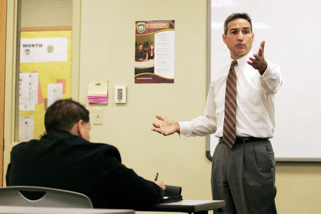 Winnebago County State's Attorney Joe Bruscato teaches a class on domestic violence at Rasmussen College in Rockford on Thursday, Oct. 21, 2010.