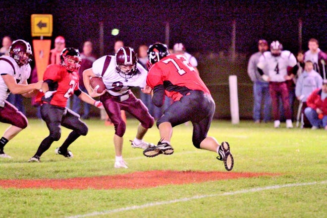 United Michael Galusha beings a tackle on a Princeville running back.