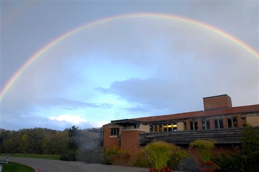 A rainbow arches over Wingspread, Saturday evening October 2, 2010 in Racine, Wis. Wingpsread, the home of the Johnson Foundation, was designed by Frank Lloyd Wright in 1937. (AP Photo/Journal Times, Mark Hertzberg)