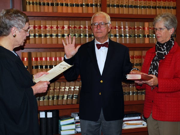 On Thursday, Chief Justice Sarah Parker (left) gave Special Superior Court Judge Gary Trawick (center) the oath to serve on the bench for five more years. Courtesy photo