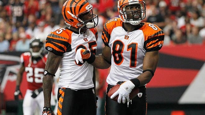 Chad Ochocinco (left) and Terrell Owens have combined for 77 catches in six games for Cincinnati, but the Bengals have struggled to a 2-4 start.