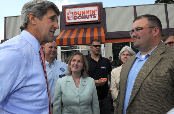On his tour through downtown Framingham, U.S. Sen. John Kerry was greeted at Dunkin' Donuts by state Rep. Pam Richardson and selectmen Chairman Jason Smith.