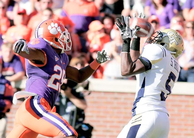 Clemson's Xavier Brewer (left) breaks up a pass intended for Georgia Tech's Stephen Hill during a game last week. The Associated Press