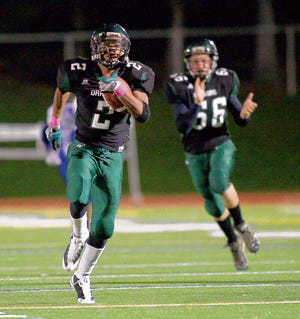 Tyree Smallwood runs the ball for Cornwall on Friday night.