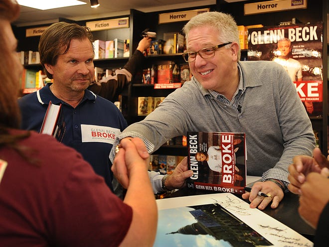 Conservative television host and political commentator Glenn Beck shakes hands with an admirer during his book signing at Tatnuck Bookseller in Westborough Saturday.